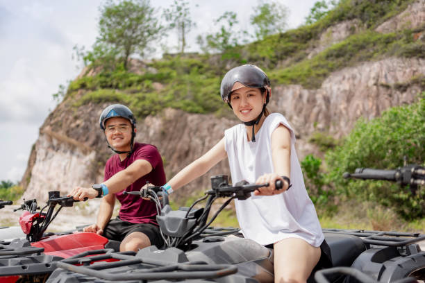 istock Couple riding ATV outdoor 2192917034