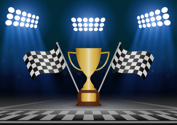 istock Golden Trophy Cup or Racing Champion Cup  with Checkered Flag in Racing Track. Champion and Winning or Celebration Concept. 2192920787