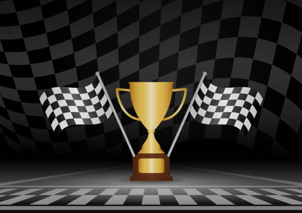 istock Golden Trophy Cup or Racing Champion Cup  with Checkered Flag in Racing Track. Champion and Winning or Celebration Concept. 2192921375