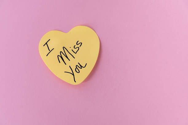 istock Yellow Heart-Shaped Post-It Note with I Miss You 2192922410