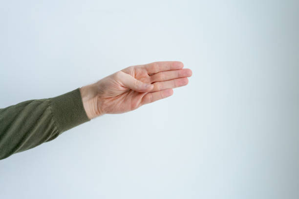 Male hand with two fingers extended, background is white