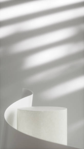 istock Minimalist white abstract composition with curved paper and textured cylinder 2192924971