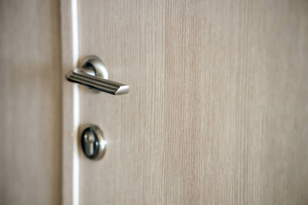istock A door with a silver handle and a keyhole 2192925447