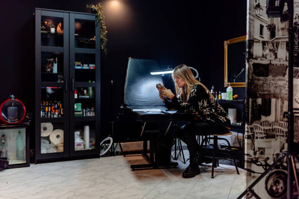 istock Tattoo artist resting between sessions in stylish studio environment 2192927583