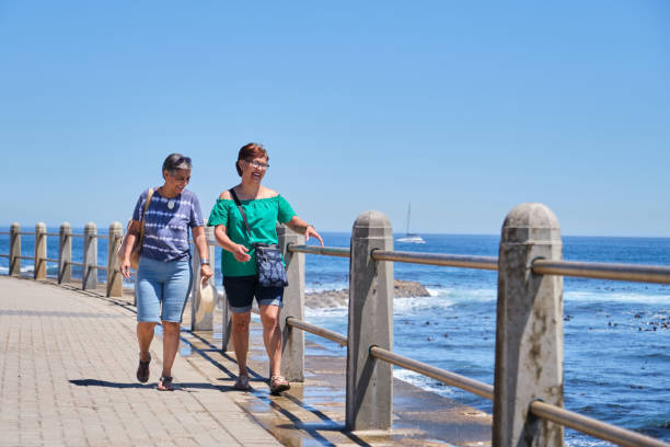 istock Two senior woman walking along a coastal path in Cape Town 2192928904