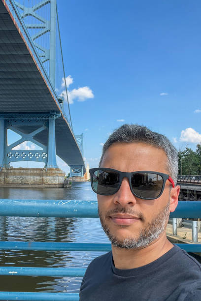 istock Benjamin Franklin bridge is a suspension bridge, and the water below is calm 2192931102