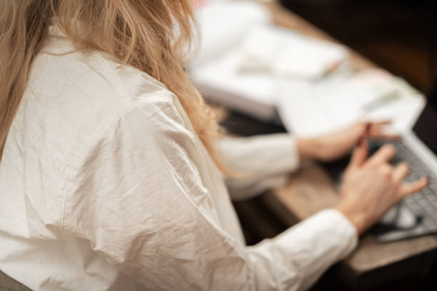 istock Woman freelancer working on laptop at table at home 2192932384