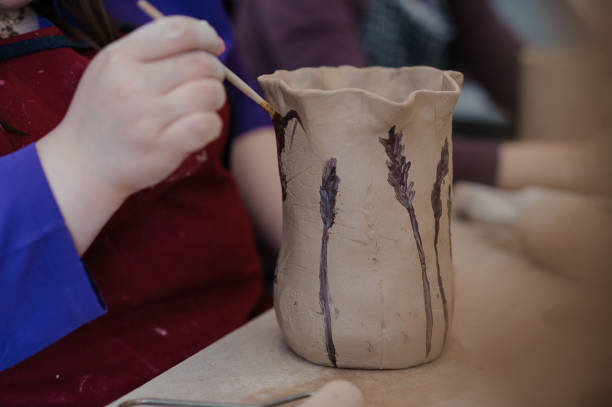 istock Artistic Pottery Creation: Decorative Vase Painting in a Craft Workshop 2192932473