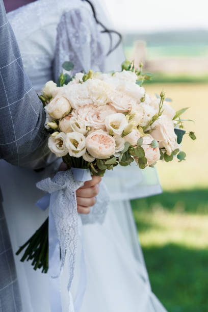 istock Romantic Bridal Bouquet with Soft Pastel Flowers in Natural Setting 2192932498