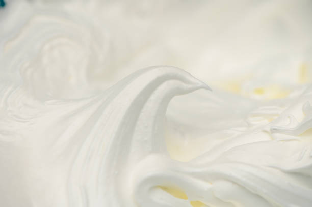 Perfectly whipped cream swirls create a delightful topping for desserts and drinks
