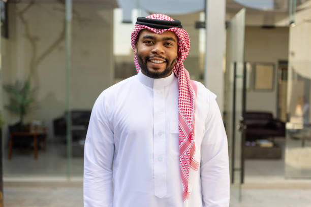 istock Happy young Saudi man standing in office lobby 2192933467