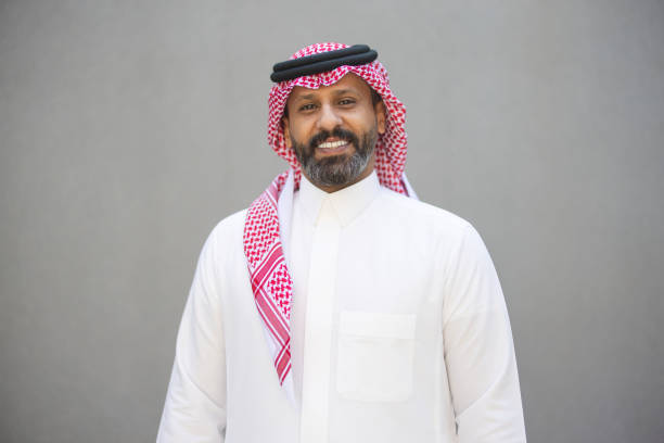 istock Bearded Arab man in traditional attire smiling at camera 2192933478