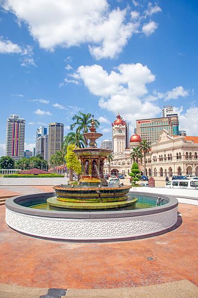 istock Historic clock tower and fountain in central Kuala Lumpur 2192934487