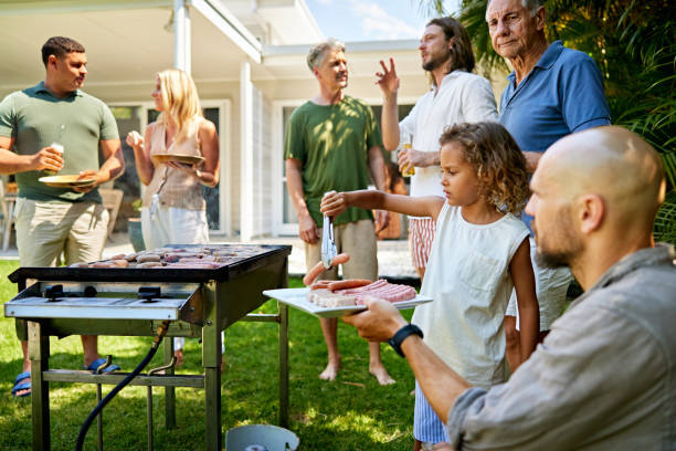 istock Men overseeing young barbecuer in training 2192934563