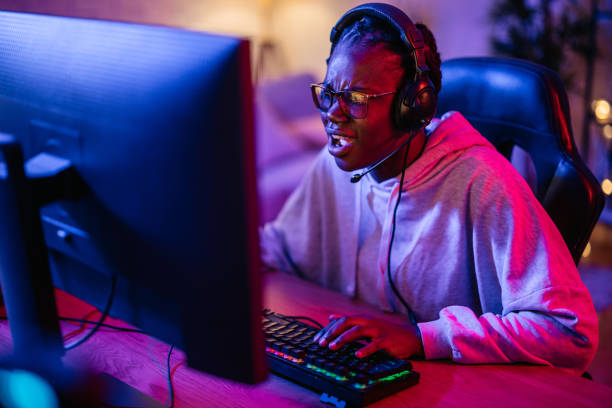 istock Young Black Woman Losing While Playing A Video Game On Her Desktop PC 2192936435