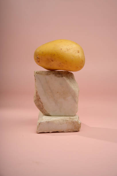 istock minimalist still life with a potato on a pink background 2192936769