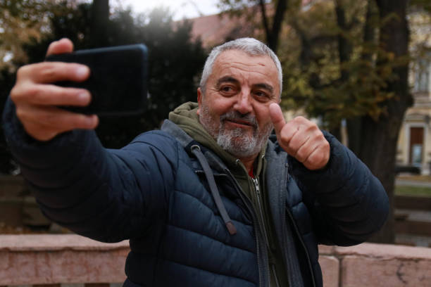 positive news emotions video call using technology smart phone bearded smiling