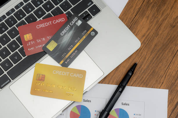 istock Credit card and  computer laptop on the working desk 2192937645