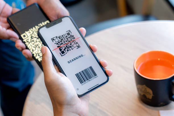 istock Customer using phone for payment at cafe restaurant, cashless QR code technology and money transfer. 2192937656