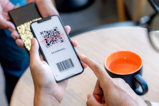 istock Customer using phone for payment at cafe restaurant, cashless QR code technology and money transfer. 2192937662