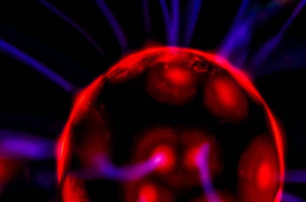 A red glowing ball with purple and blue streaks. The ball is surrounded by purple and blue lines