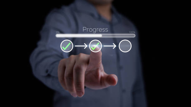 istock Businessman touching on tick check mark in checklist with progress bar loading status in concept of project work progress tracking and project management. 2192941076