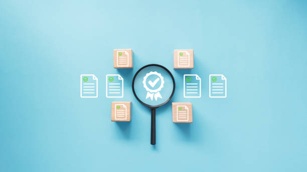 istock Magnifying glass with certificate icon at center and surround by document with green check mark in document management, validation and quality control concept. 2192941191