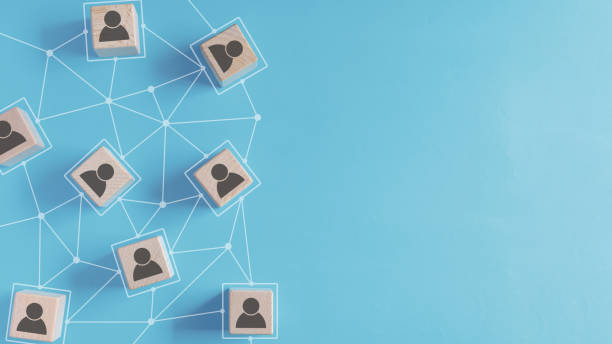 istock Cube wooden block with man icon and connected line on pastel blue background with empty copy space in concept of human resource, recruitment, human and relationship management. 2192941206