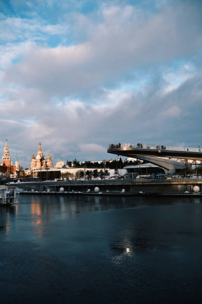 Moscow, Russia - January 05, 2025: Kremlin and footbridge in Zaryadye Park. Winter view from Moskva River