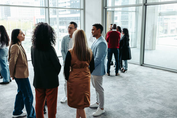istock Group of professionals networking during a conference at a modern office event 2192945958