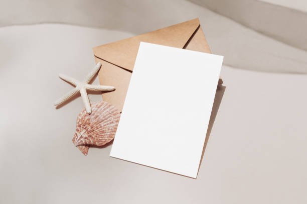 Beach themed 5x7 card mockup with envelope and starfish, incitation template angle view