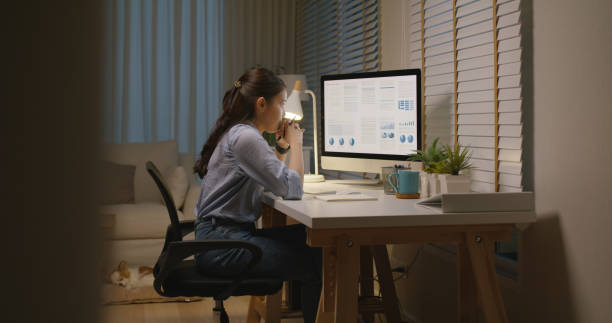istock Asia people young woman study hard overnight brownout bored remote learn online read data tired sitting head in hands at home office desk workplace think worry in job tough stress workforce issue. 2192948284