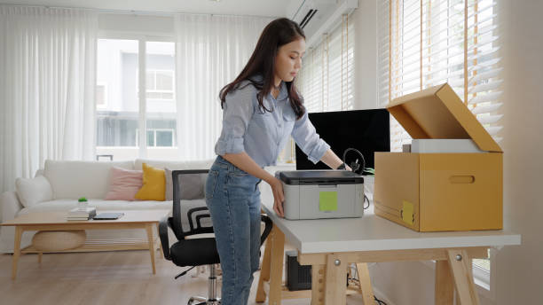 istock Future of workforce remote work fully permanent. Asia people happy relax move job to new small workspace set up desk picking file folder from box. Keep it chores neat start long term plan career work. 2192948347