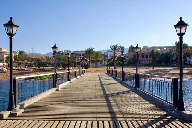 istock Relax on the beach with umbrellas and sun loungers 2192953689