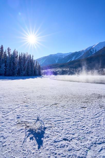 istock Serene winter landscape with snow and sun 2192954129