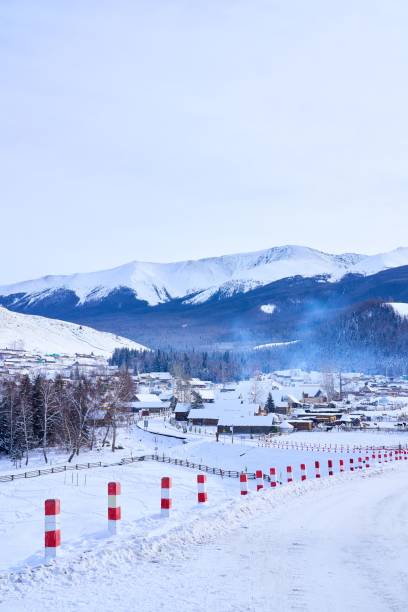 istock Winter village with snow-covered mountains. 2192954160