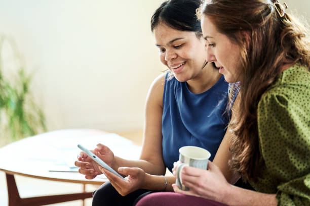 istock Happy business partners using smartphone during break at home office 2192956973