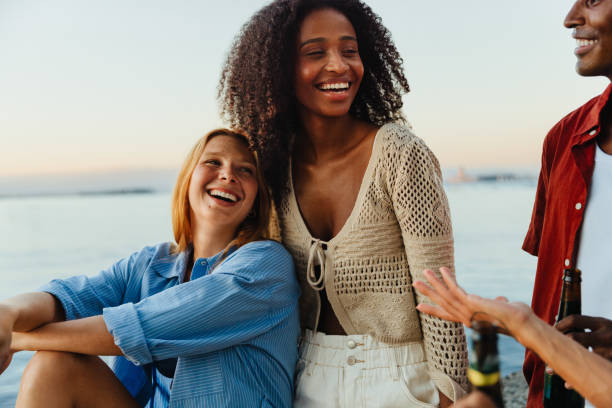 istock Joyful young adults enjoying summer by the waterfront 2192961126