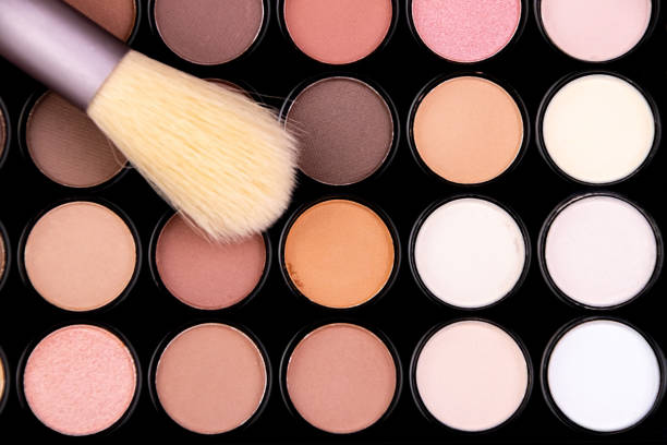 istock Makeup brush glides over an array of colorful eyeshadow shades during a beauty application session, highlighting artistry and creativity in cosmetics 2192965488