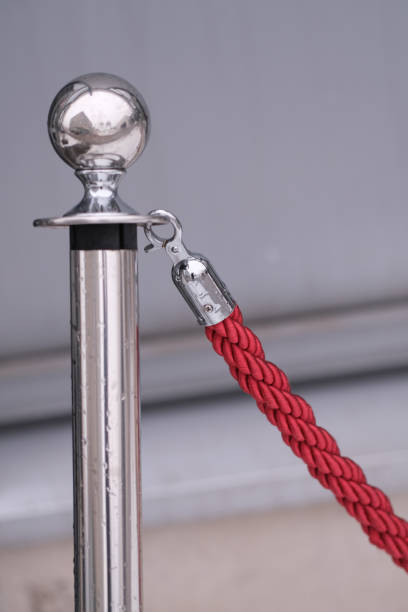 istock Shiny pole of a red rope fence 2192967145