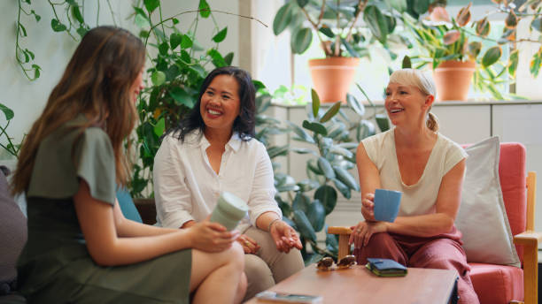 istock Professional Businesswomen Taking a Coffee Break and Socializing in a Green Office Setting 2192968930