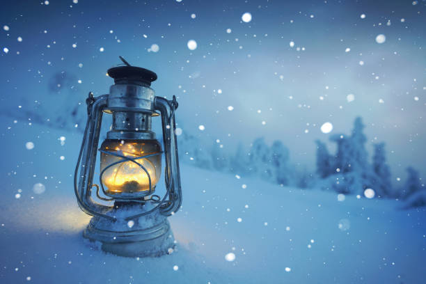 istock romantic winter landscape - vintage lamp in the snow 2192970168