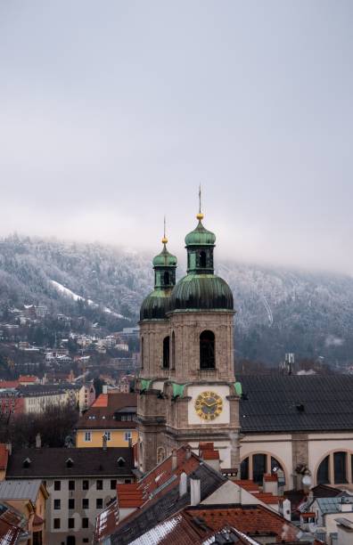 istock Innsbruck's St. James Cathedral and snowy mountains. 2192971403