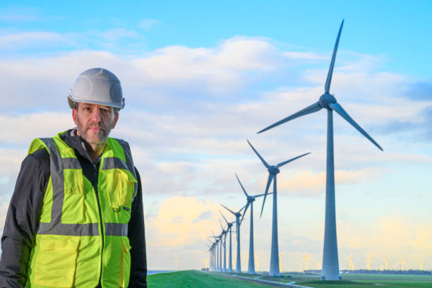 istock Technician in front of wind turbines in wind park 2192971762