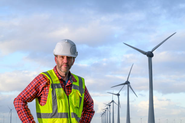 istock Technician in front of wind turbines in wind park 2192971905