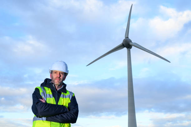 istock Technician in front of wind turbines in wind park 2192971934