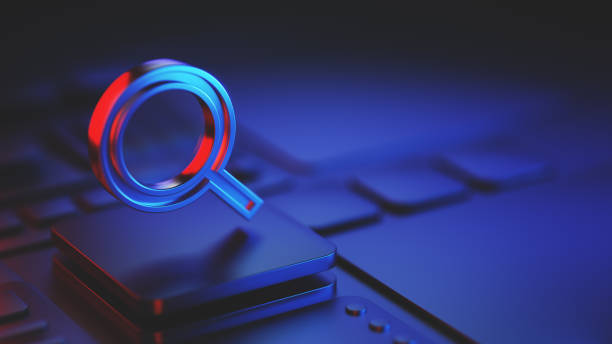 istock Magnifying Glass Icon Over a Keyboard with Red and Blue Lighting 2192972131
