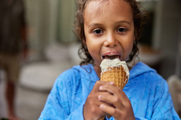 istock Active boy tired from swimming and enjoying ice cream cone 2192972254