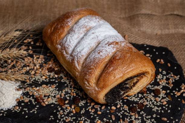 istock Freshly baked bread roll with poppy seeds. 2192973331