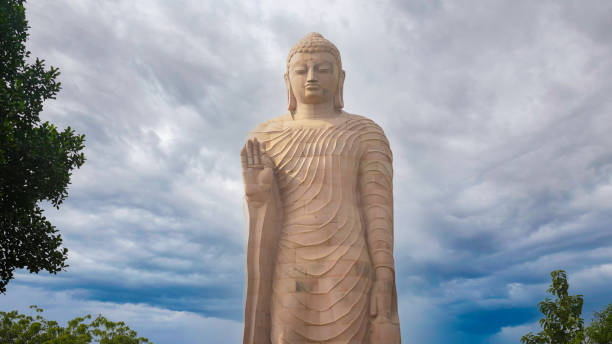 istock Majestic Buddha statue at Sarnath standing tall against the blue sky 2192973528